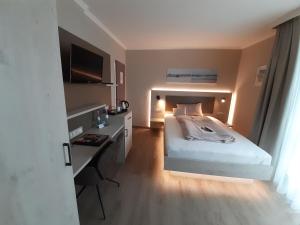 Postel nebo postele na pokoji v ubytování Apart Hotel Norden