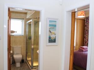 a bathroom with a shower and a toilet and a sink at Cherry Fields in Chesterfield +32 photos