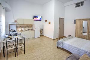 A kitchen or kitchenette at HAROULENA