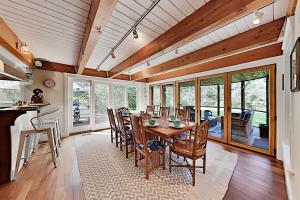 a dining room with a table and chairs at Oyster Pond Paradise in West Tisbury