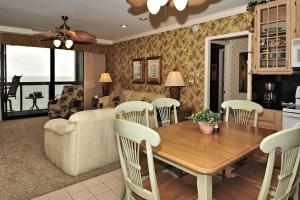 a kitchen and living room with a table and chairs at Golden Sands XII in Ocean City