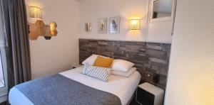 Cama ou camas em um quarto em Hotel De L'Europe
