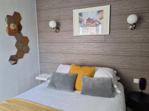 Cama ou camas em um quarto em Hotel De L'Europe