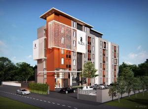 a rendering of a building with cars parked in front at Kuda Asia Hotel Bang Saen in Bangsaen