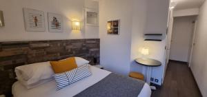 Cama ou camas em um quarto em Hotel De L'Europe