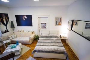 a living room with a bed and a couch at Apartment Park in Belgrade