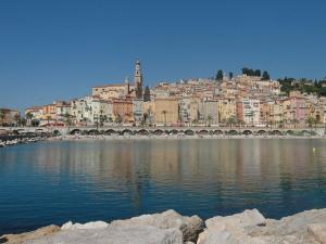 a city with a bridge over a body of water at Hotel Chambord in Menton