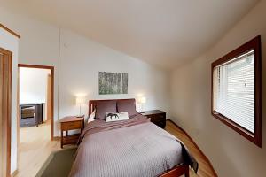 a bedroom with a large bed in a room at Retro Chic Roundhouse Retreat in Breckenridge