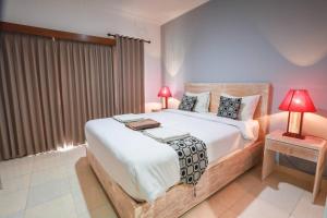 Postel nebo postele na pokoji v ubytování Adi Guest House