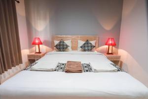 Postel nebo postele na pokoji v ubytování Adi Guest House