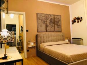 Ένα ή περισσότερα κρεβάτια σε δωμάτιο στο La maison ,appartamento di charme e benessere