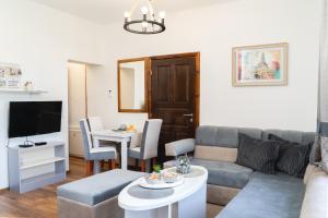 a living room with a couch and a table at Villa Adelaida in Sarajevo