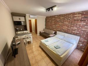 Posteľ alebo postele v izbe v ubytovaní Dalma Apartment