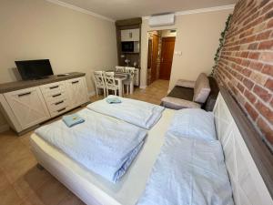 Posteľ alebo postele v izbe v ubytovaní Dalma Apartment