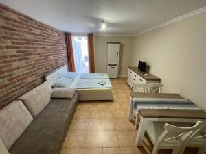 Posteľ alebo postele v izbe v ubytovaní Dalma Apartment
