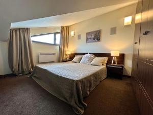 Ένα ή περισσότερα κρεβάτια σε δωμάτιο στο Luxury Apartment Pirin Chalet in Terra Complex +44 φωτογραφίες