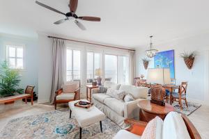 a living room with a couch and a table at The Grand Sandestin II in Destin