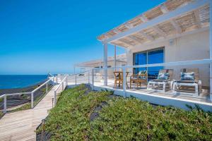 a house on the beach with a view of the ocean at Etti-Paradise Suite La Ballena in Pájara +28 photos