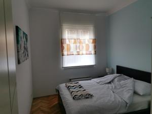 Postel nebo postele na pokoji v ubytování Apartman LUI