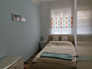 Postel nebo postele na pokoji v ubytování Apartman LUI