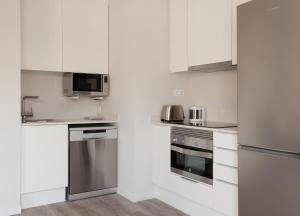 Kuchyňa alebo kuchynka v ubytovaní APBCN Eixample Center