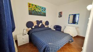 Ένα ή περισσότερα κρεβάτια σε δωμάτιο στο Villa Martina Mare