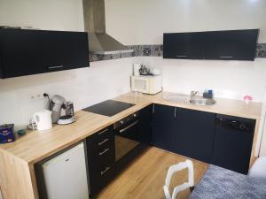 Een keuken of kitchenette bij Charmant duplex 80m²
