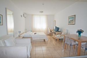 Posteľ alebo postele v izbe v ubytovaní Apartments Tamarix