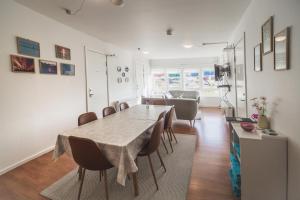 a dining room with a table and chairs at Hope Hostel in Aasiaat