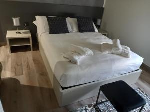 Postel nebo postele na pokoji v ubytování Residenza Novi