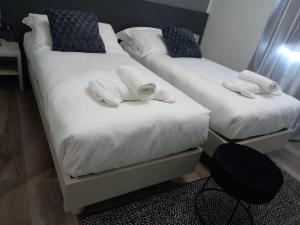 Postel nebo postele na pokoji v ubytování Residenza Novi