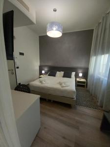 Un pat sau paturi într-o cameră la Residenza Novi