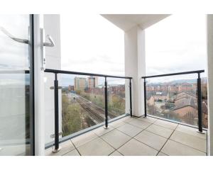 a balcony with a view of a city at Central Belfast Apartments Sandford in Belfast