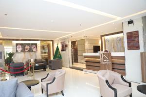 a store with chairs and tables in a room at شقق السامية للشقق المخدومة in Sharurah