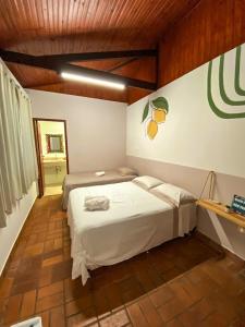 Katil atau katil-katil dalam bilik di Nosso Recanto Pérola