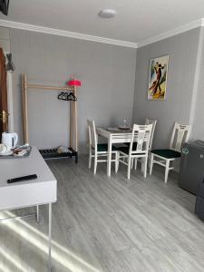 a living room with a table and chairs at Візит in Bila Tserkva +29 photos