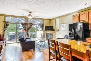 a kitchen and living room with a table and chairs at Trail's End in McHenry