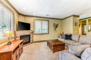 a living room with a couch and a fireplace at Trail's End in McHenry
