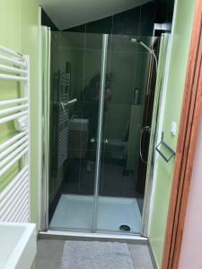 a shower with a glass door in a bathroom at Gite Beaulieu in Wimereux +20 photos