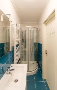 a bathroom with a sink and a shower and a tub at Kukoricza Hacienda in Bad Mitterndorf