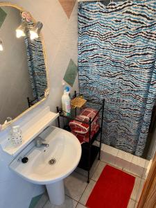a bathroom with a sink and a shower at Apartamentos Mar Azul Arinaga in Arinaga