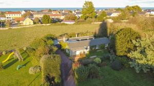 an aerial view of a house in a field at Little Omaha in Vierville-sur-Mer