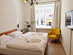 Postel nebo postele na pokoji v ubytování Rosa Rooms Meran