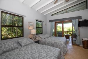 เตียงในห้องที่ Casa de Paz- Portasol Vacation Rentals