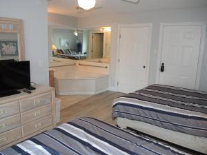 Voodi või voodid majutusasutuse 27 Holes of Golf Surrounds the Home 101L toas