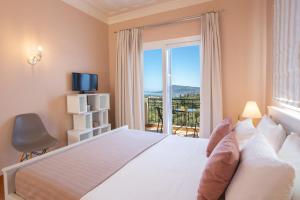 Ένα ή περισσότερα κρεβάτια σε δωμάτιο στο Villa Daphne, Inoro Villas +40 φωτογραφίες