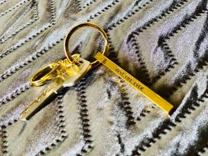 a yellow pair of scissors on top of a blanket at Pasavento - Modern Black Suite in Camaceyes +2 photos