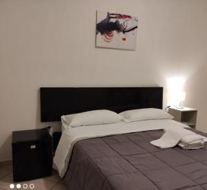Postel nebo postele na pokoji v ubytování Lorenzo B&B House