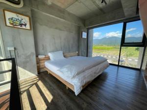 八分田有機休閒農場房間的床