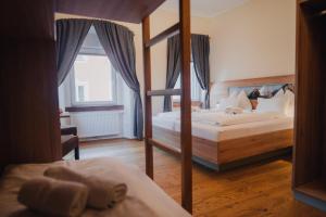 Postel nebo postele na pokoji v ubytování Hotel Restaurant DAS RÖSSL
